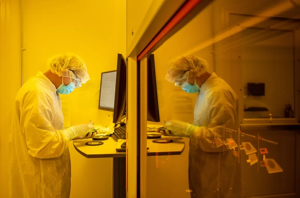 Cleanroom technician working at an assembly station